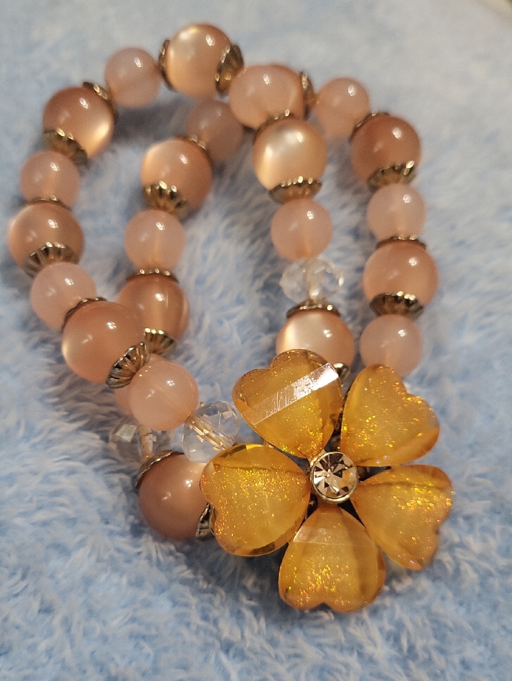 Peach Moonglow Bead Bracelet with Gold Flower Accent